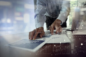 Close up of businessman working on post merger integration strategies