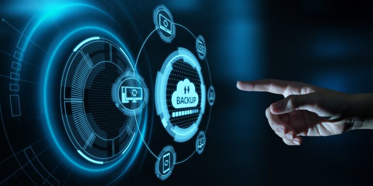 A hand is reaching out at a data backup button.