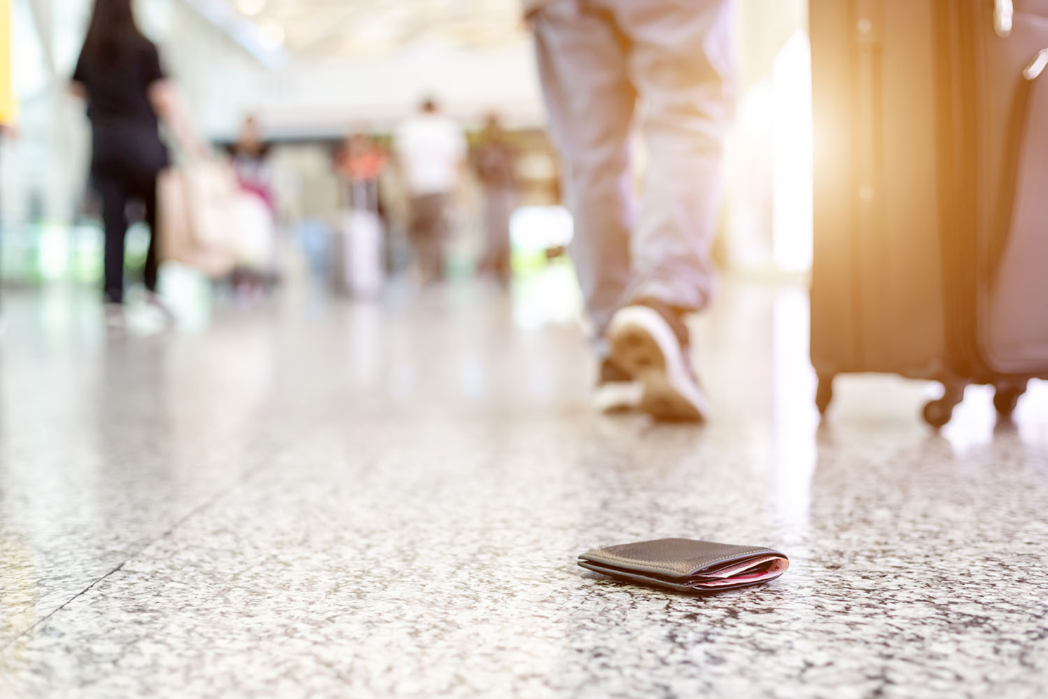 Travelers lost their wallet on the floor at the airport