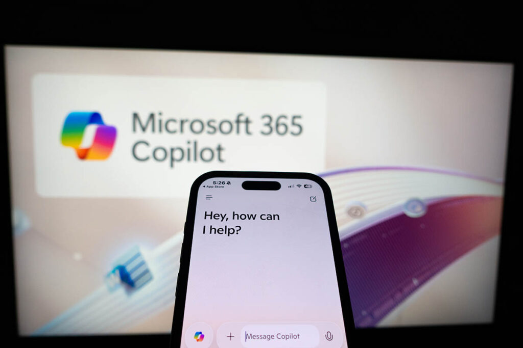 Kiel, SH, Germany - March 13, 2025: Mobile phone displaying the Microsoft AI Assistant app Copilot on the screen in front of the business website.