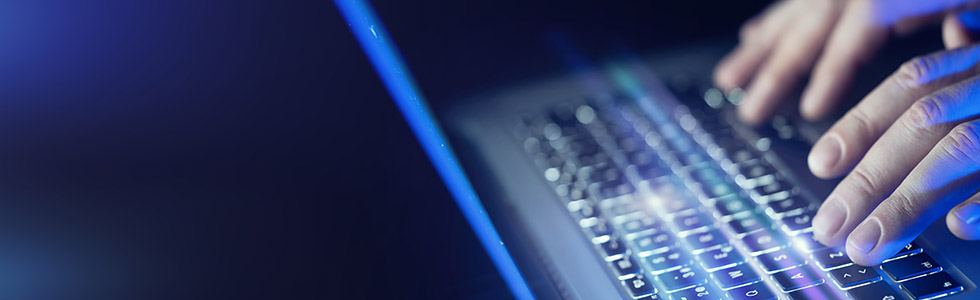 Male hands using laptop