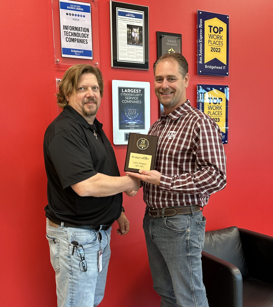 Larry Simpson receiving his 20 year recognition alongside Bridgehead IT COO, Chris Brandvik.